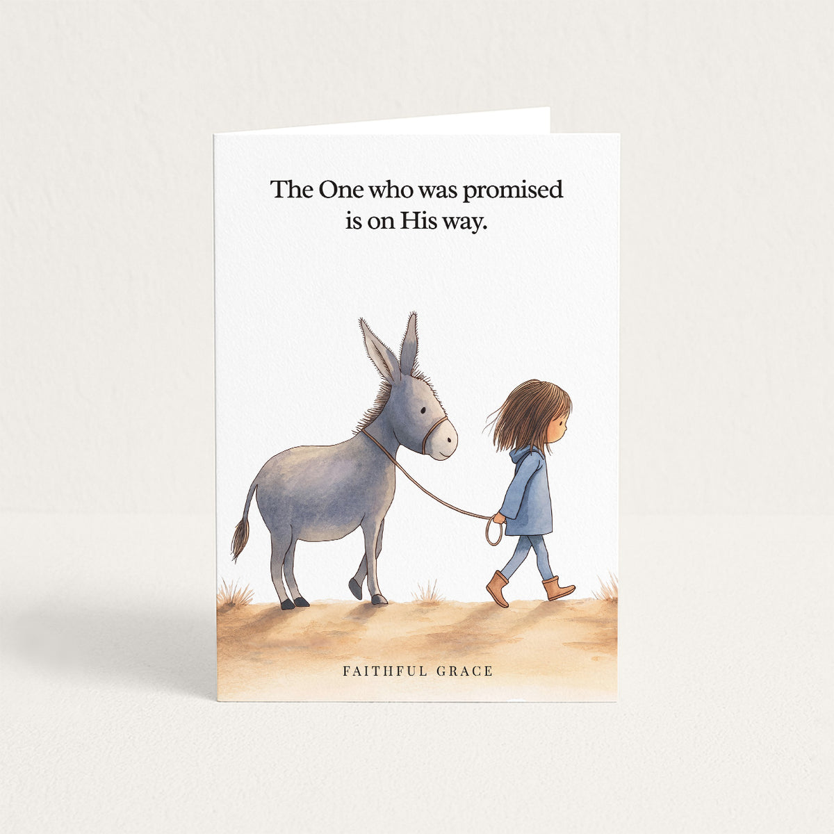Christmas card reading "The One who was promised is on His way."
