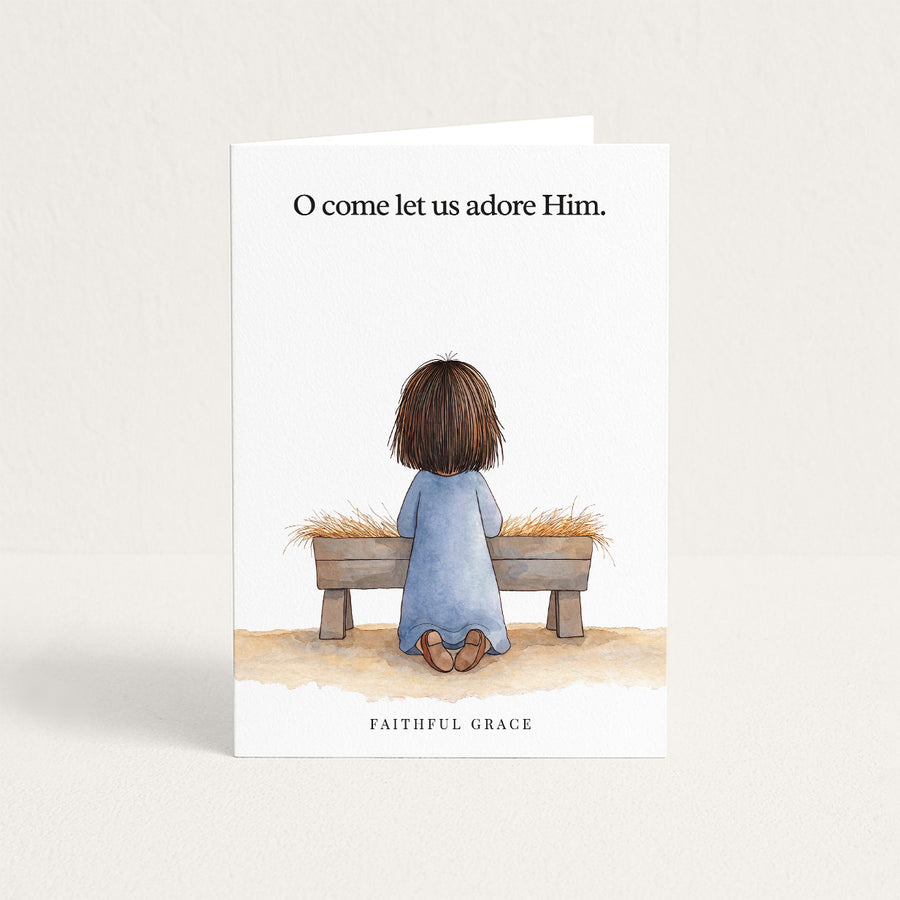 Christmas card reading "O come let us adore Him."