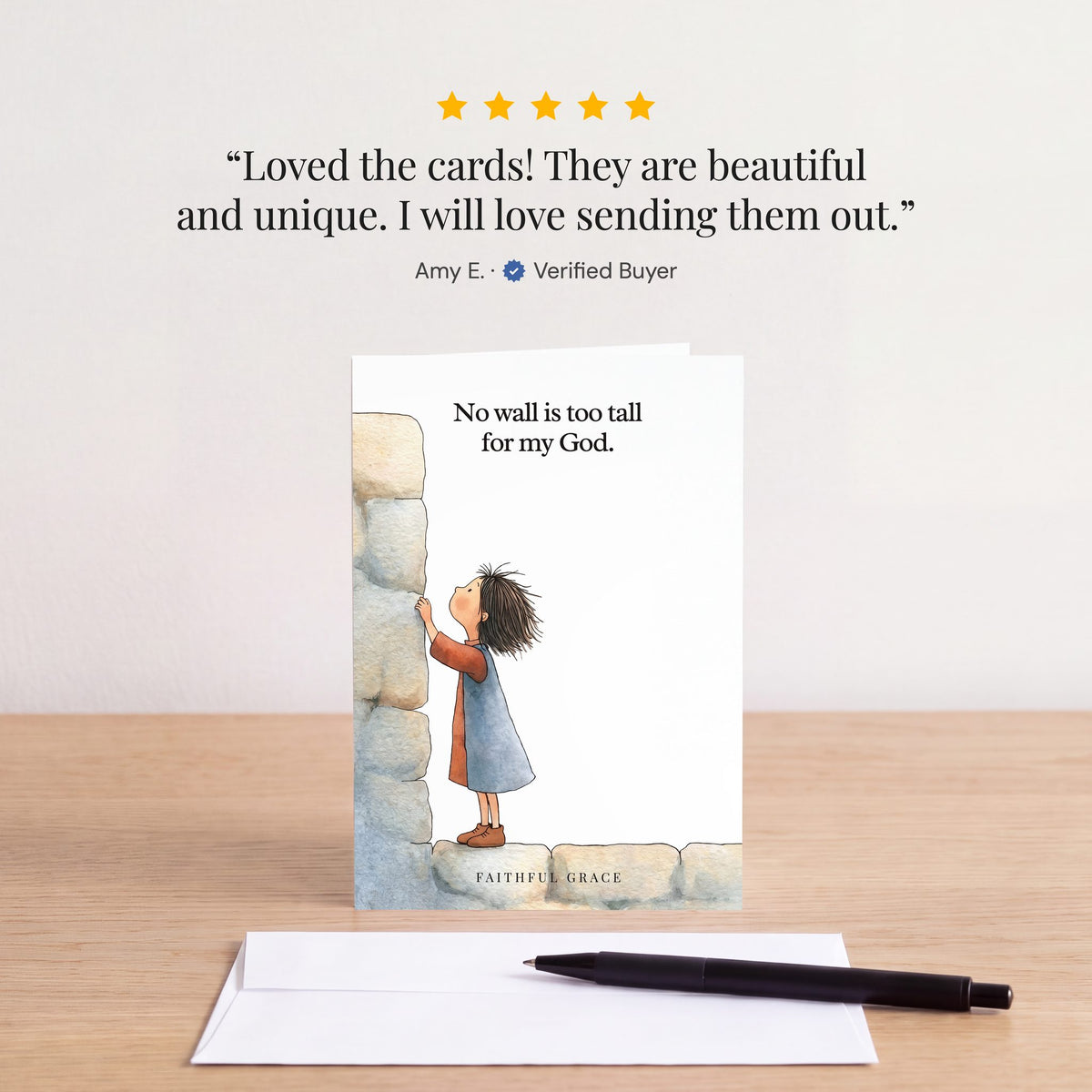 The No wall is too tall card on a table with a white envelope. Review: "Loved the cards! They are beautiful and unique. I will love sending them out." Amy E.