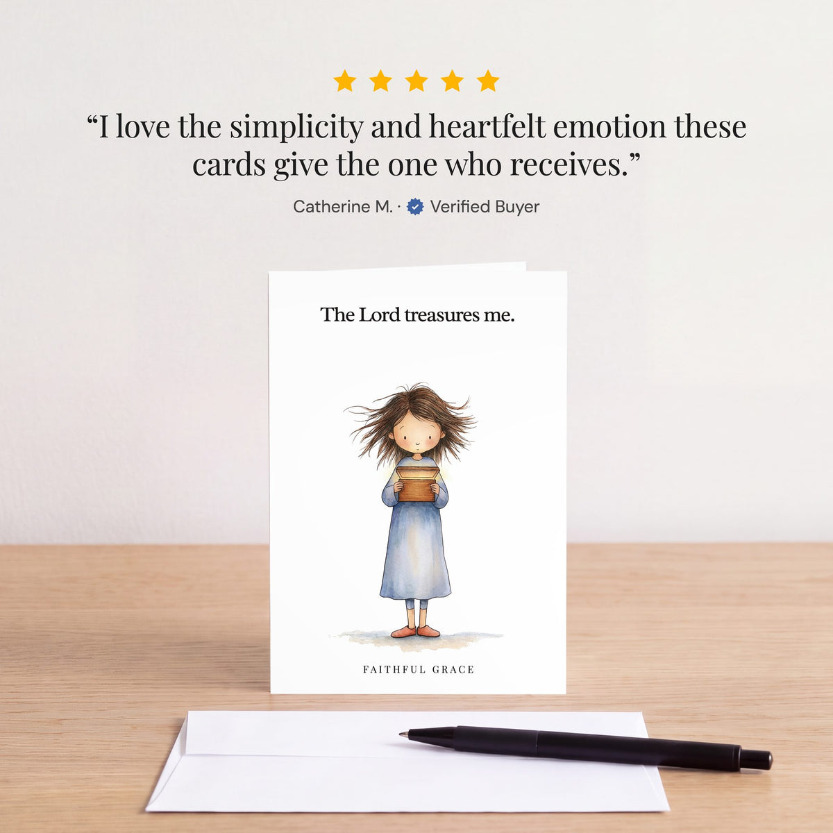 The The Lord treasures me card on a table with a white envelope. Review: "I love the simplicity and heartfelt emotion these cards give the one who receives." Catherine M.