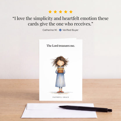 The The Lord treasures me card on a table with a white envelope. Review: "I love the simplicity and heartfelt emotion these cards give the one who receives." Catherine M.