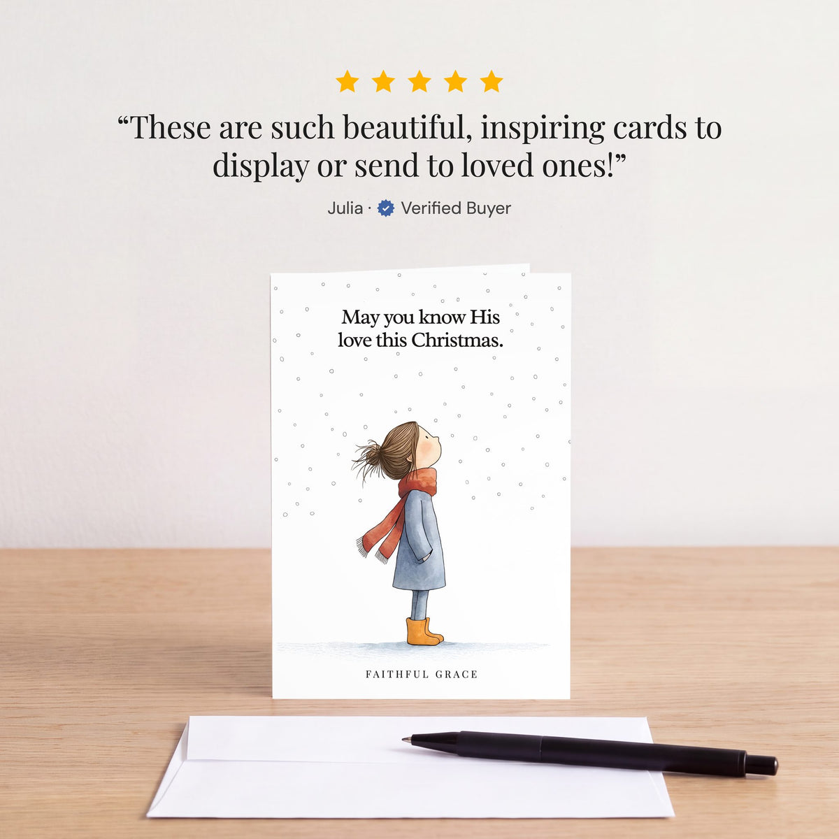 The Know His love this Christmas card on a table with a white envelope. Review: "These are such beautiful, inspiring cards to display or send to loved ones!" Julia