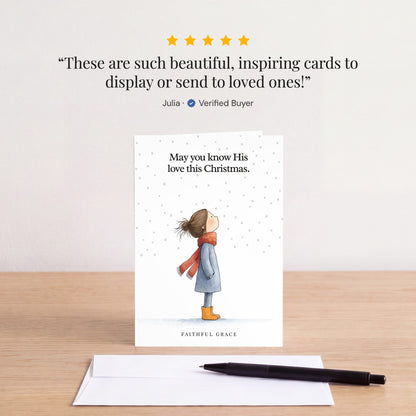 The Know His love this Christmas card on a table with a white envelope. Review: "These are such beautiful, inspiring cards to display or send to loved ones!" Julia