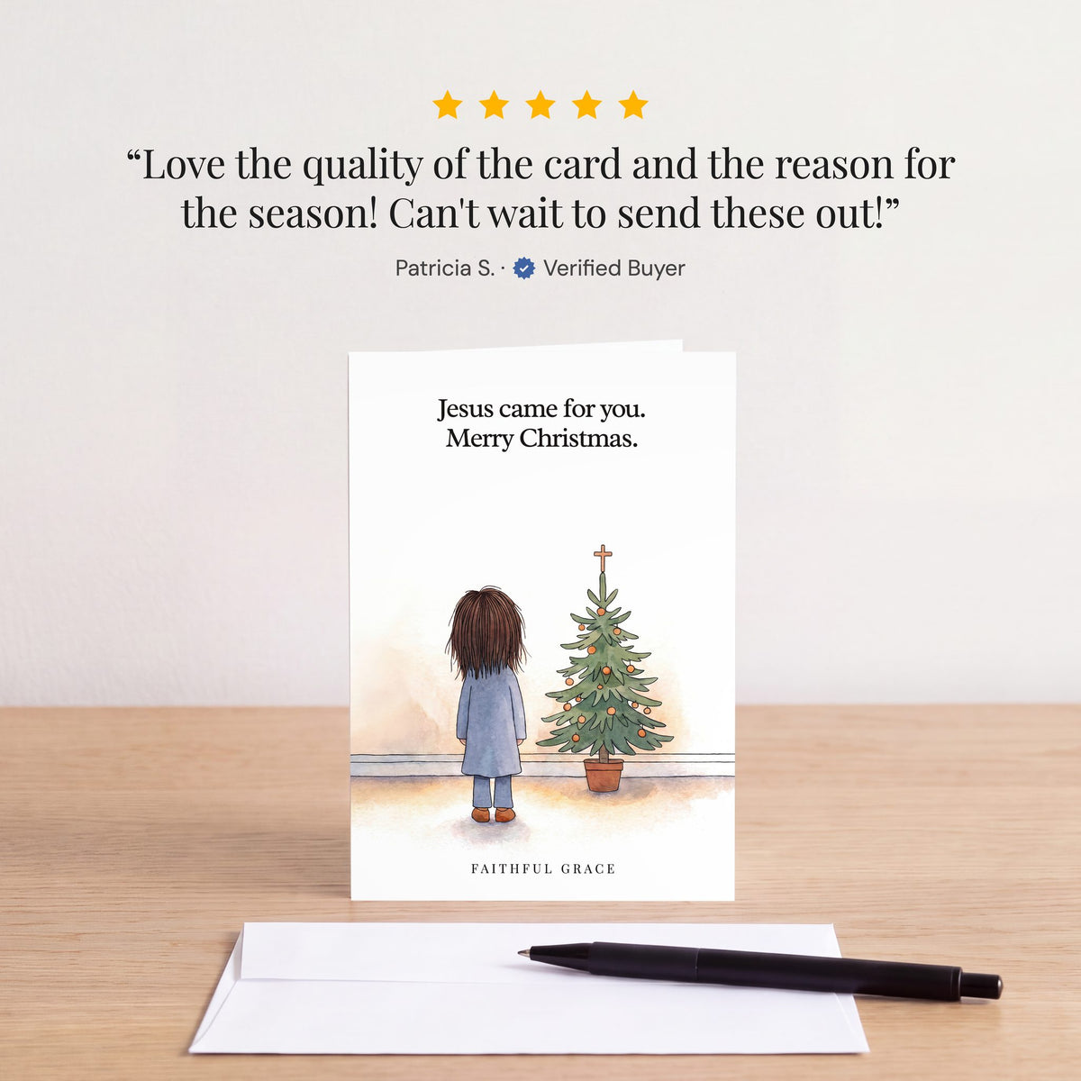 The Jesus came for you card on a table with a white envelope. Review: "Love the quality of the card and the reason for the season! Can't wait to send these out!" Patricia S.