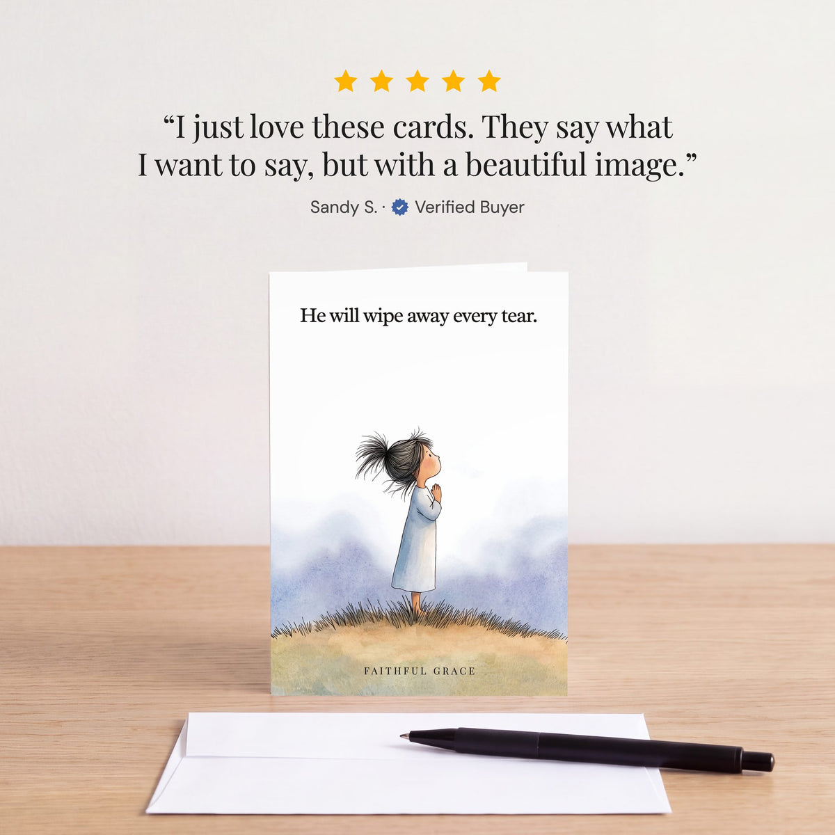 The He will wipe away every tear card on a table with a white envelope. Review: "I just love these cards. They say what I want to say, but with a beautiful image." Sandy S.