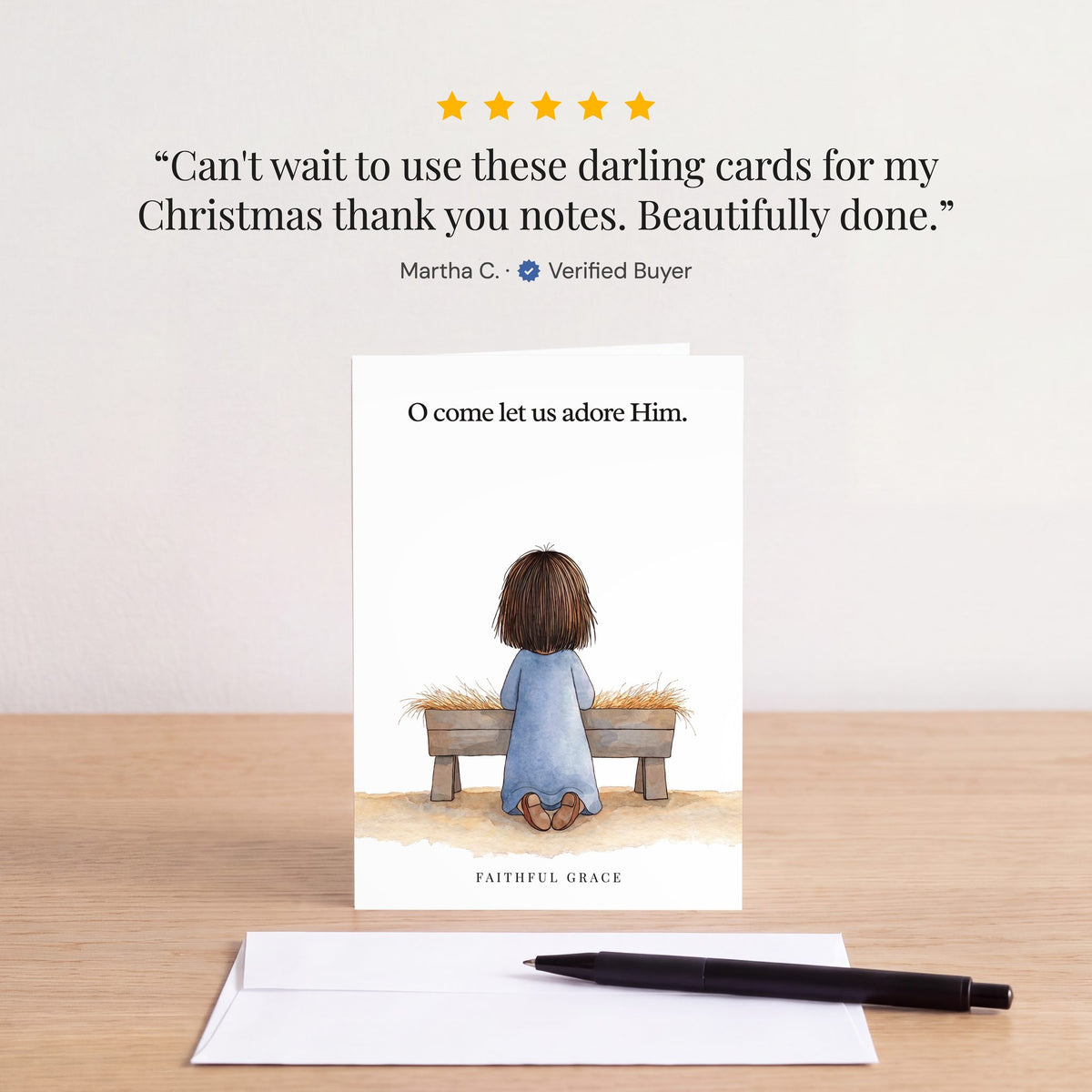 The O come let us adore Him card on a table with a white envelope. Review: "Can't wait to use these darling cards for my Christmas thank you notes. Beautifully done." Martha C.