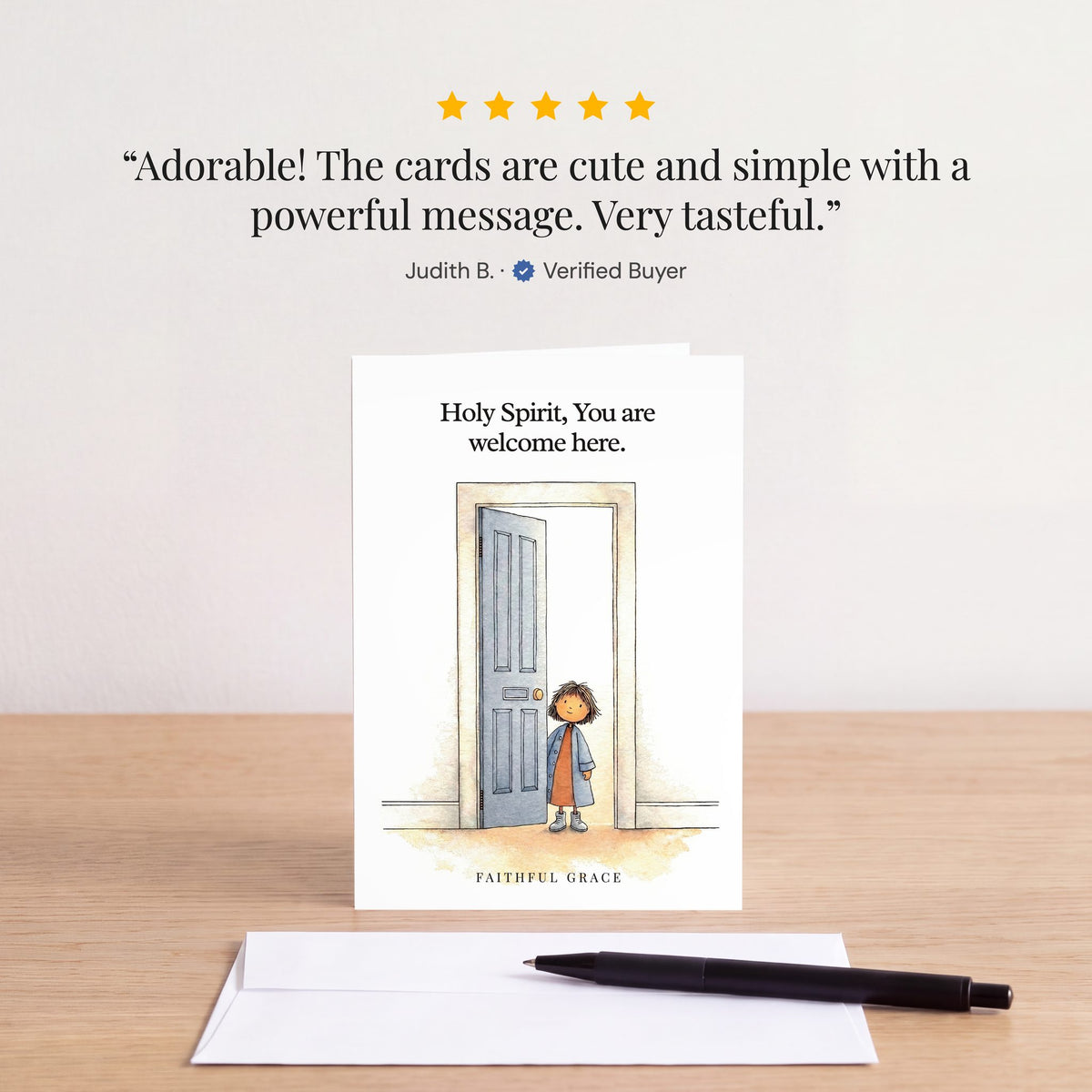 The Holy Spirit, You are welcome here card on a table with a white envelope. Review: "Adorable! The cards are cute and simple with a powerful message. Very tasteful." Judith B.