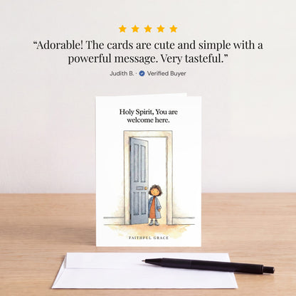 The Holy Spirit, You are welcome here card on a table with a white envelope. Review: "Adorable! The cards are cute and simple with a powerful message. Very tasteful." Judith B.