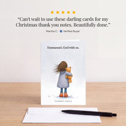 The Emmanuel. God with us card on a table with a white envelope. Review: "Can't wait to use these darling cards for my Christmas thank you notes. Beautifully done." Martha C.