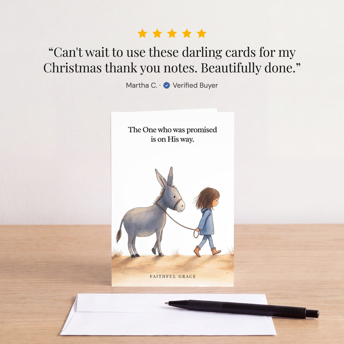 The The One who was promised card on a table with a white envelope. Review: "Can't wait to use these darling cards for my Christmas thank you notes. Beautifully done." Martha C.