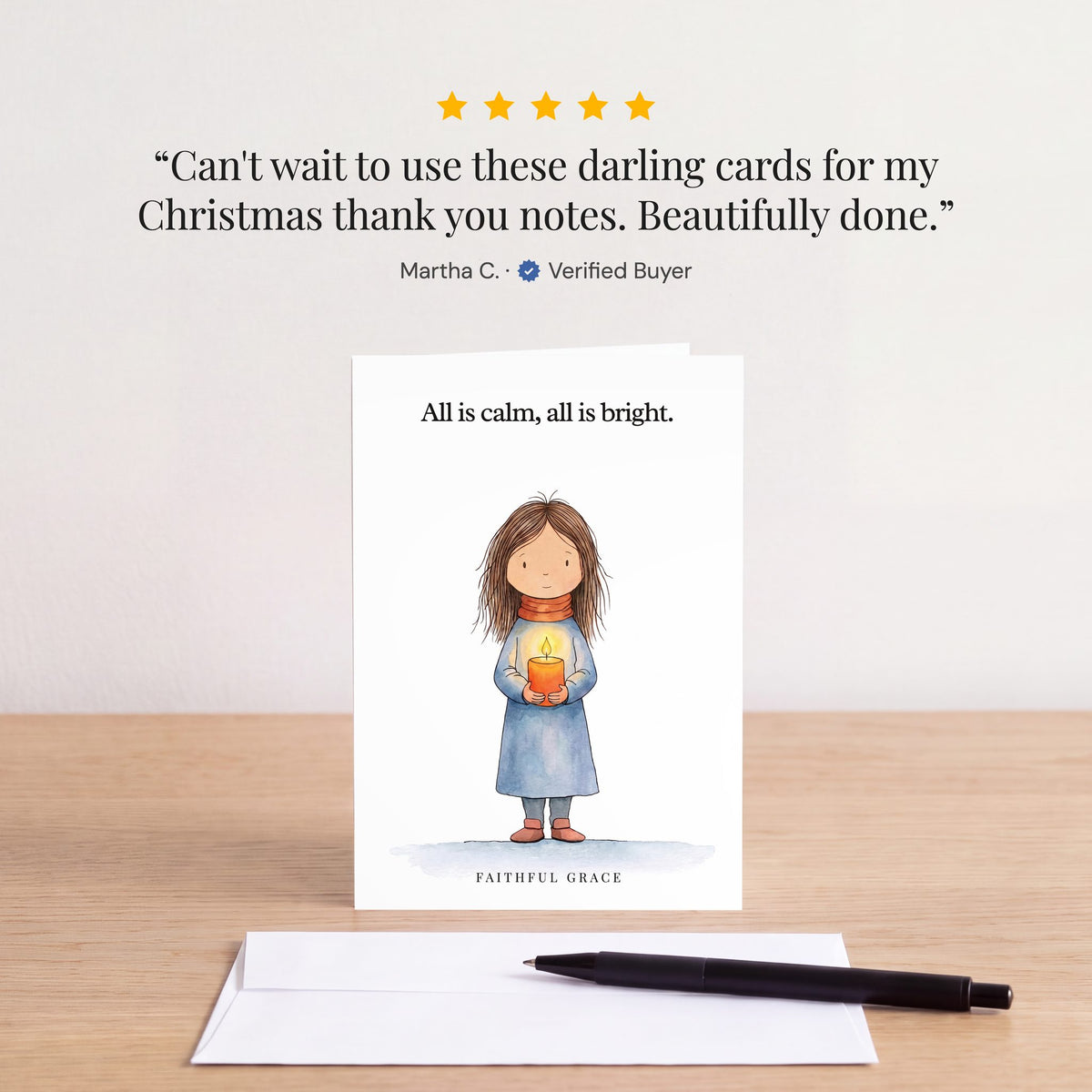 The All is calm, all is bright card on a table with a white envelope. Review: "Can't wait to use these darling cards for my Christmas thank you notes. Beautifully done." Martha C.