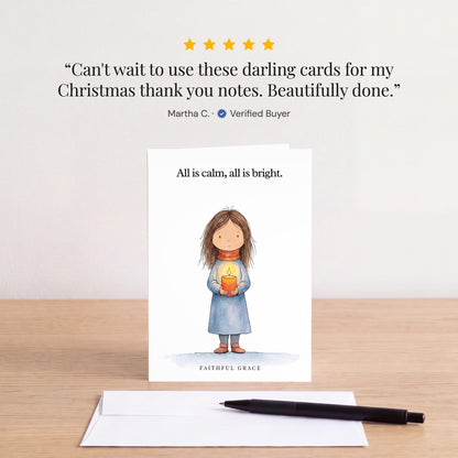 The All is calm, all is bright card on a table with a white envelope. Review: "Can't wait to use these darling cards for my Christmas thank you notes. Beautifully done." Martha C.