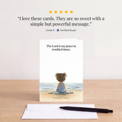 The My peace in troubled times card on a table with a white envelope. Review: "I love these cards. They are so sweet with a simple but powerful message." Linda S.