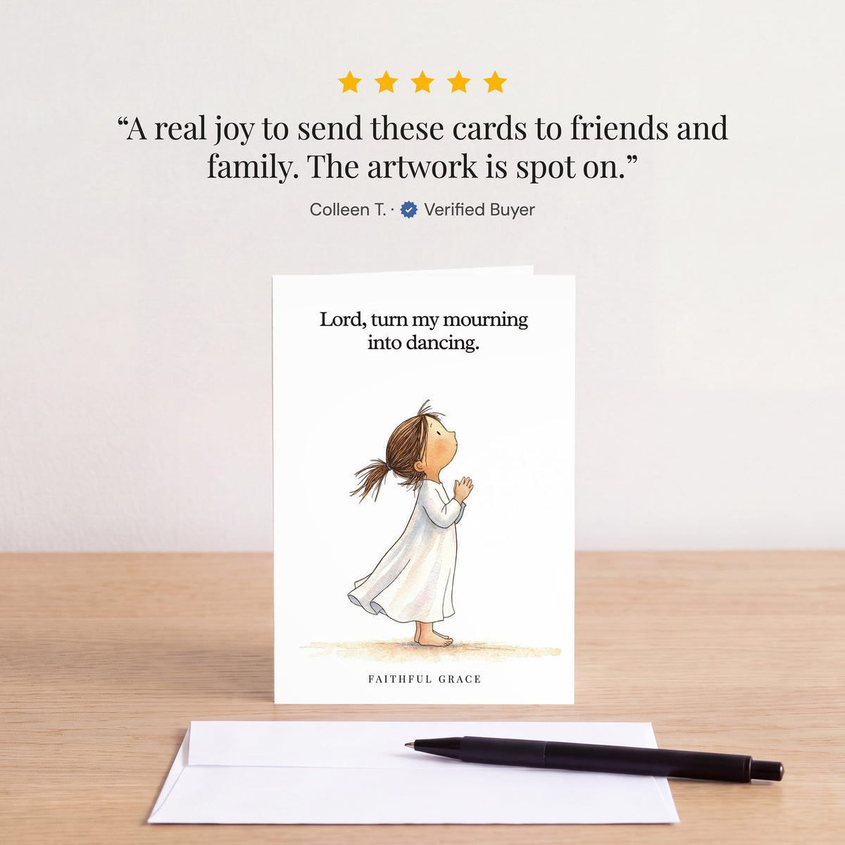 The Turn my mourning into dancing card on a table with a white envelope. Review: "A real joy to send these cards to friends and family. The artwork is spot on." Colleen T.