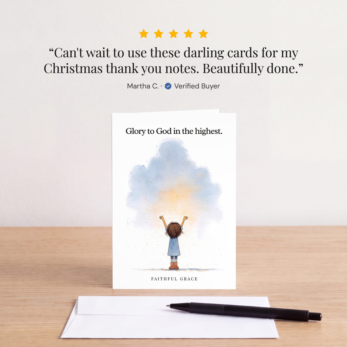 The Glory to God in the highest card on a table with a white envelope. Review: "Can't wait to use these darling cards for my Christmas thank you notes. Beautifully done." Martha C.
