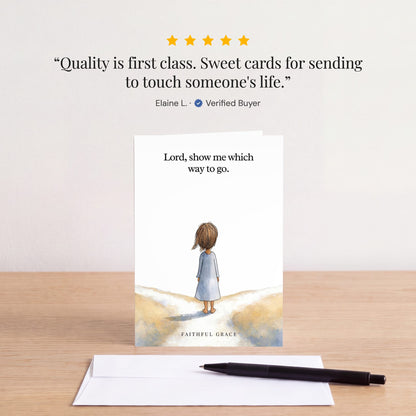 The Show me which way to go card on a table with a white envelope. Review: "Quality is first class. Sweet cards for sending to touch someone's life." Elaine L.