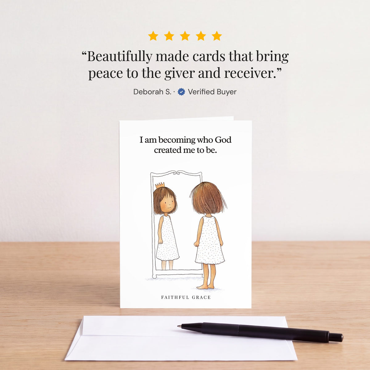 The Becoming who God created me to be card on a table with a white envelope. Review: "Beautifully made cards that bring peace to the giver and receiver." Deborah S.