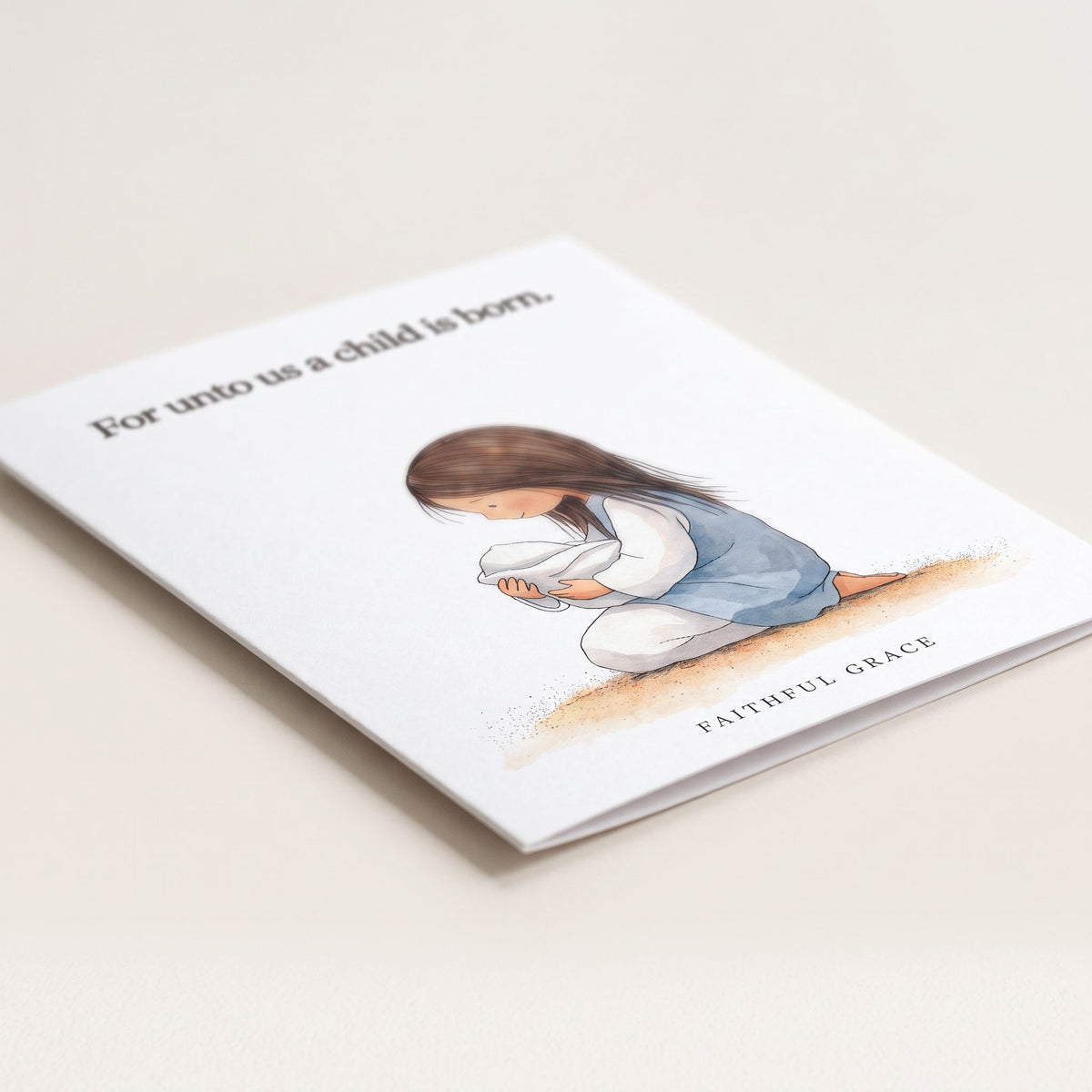 Close-up of the For unto us a child is born card showing the smooth matte finish and fold