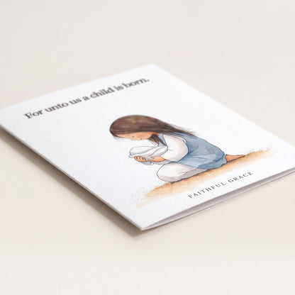Close-up of the For unto us a child is born card showing the smooth matte finish and fold