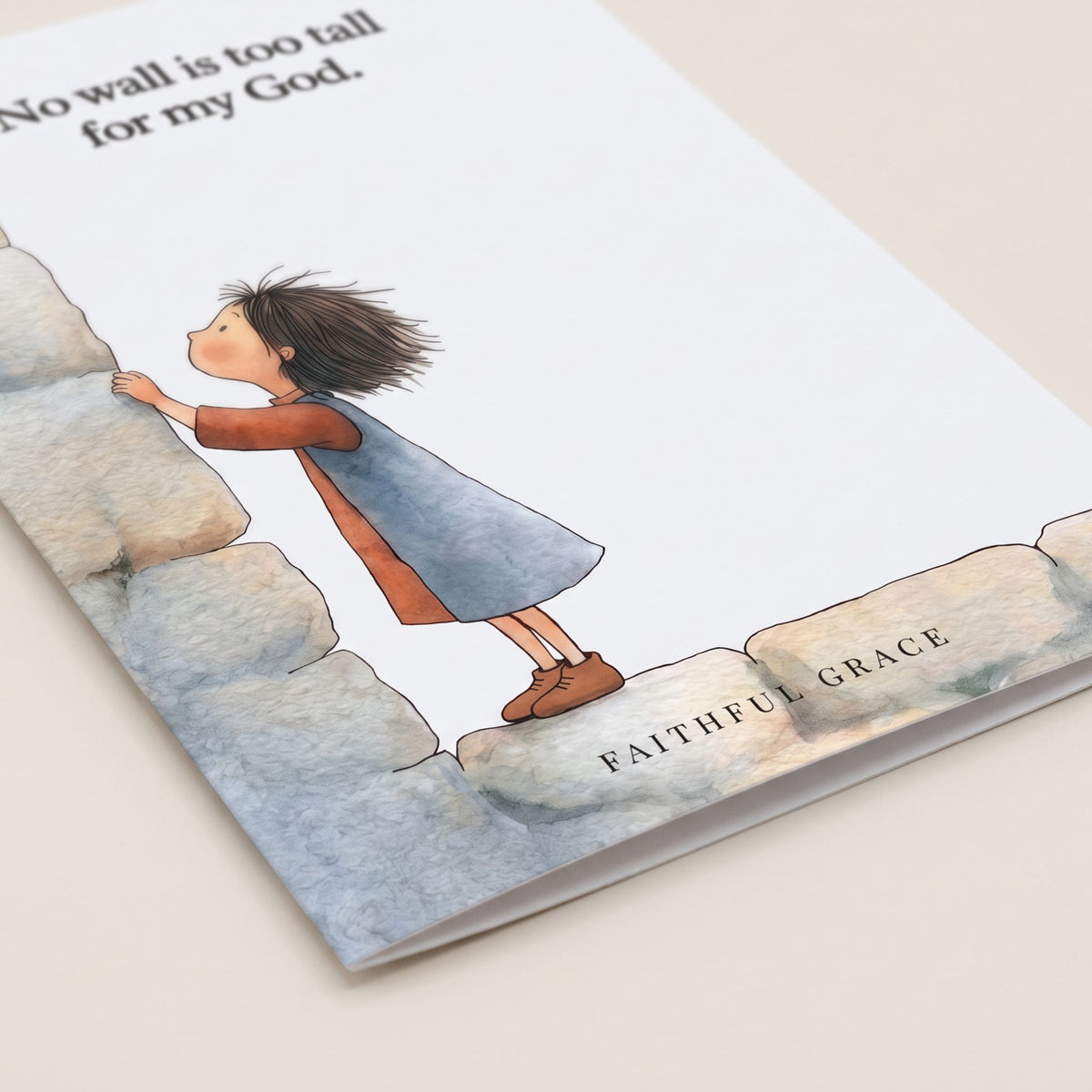 Close-up of the No wall is too tall card showing the smooth matte finish and fold