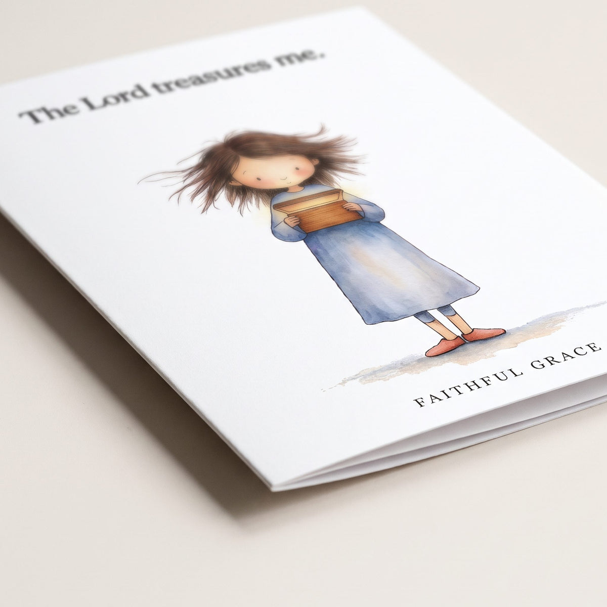 Close-up of the The Lord treasures me card showing the smooth matte finish and fold