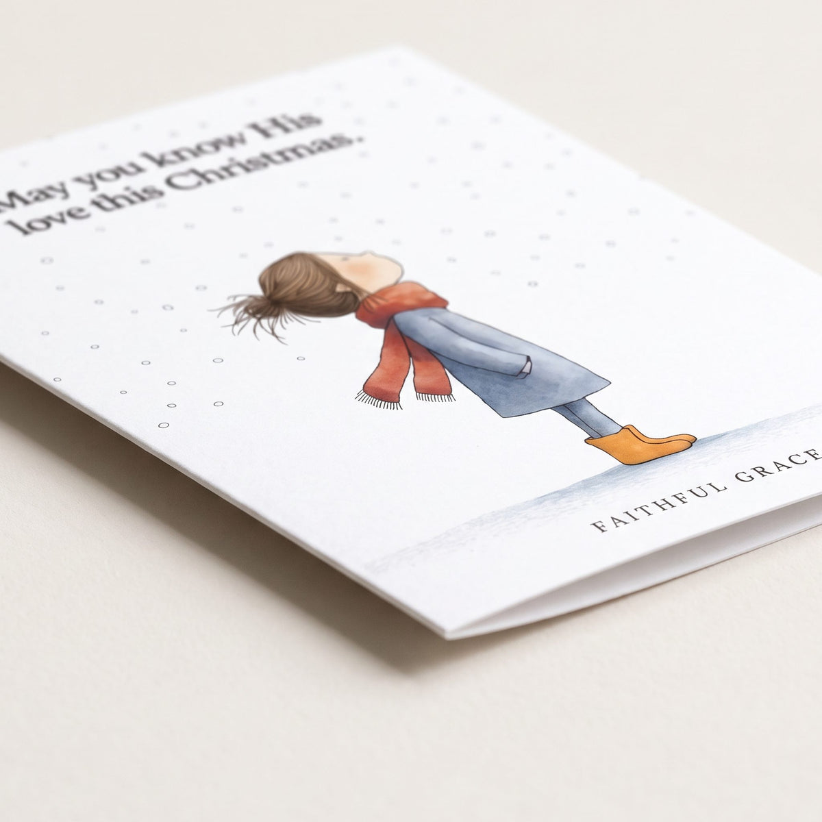 Close-up of the Know His love this Christmas card showing the smooth matte finish and fold