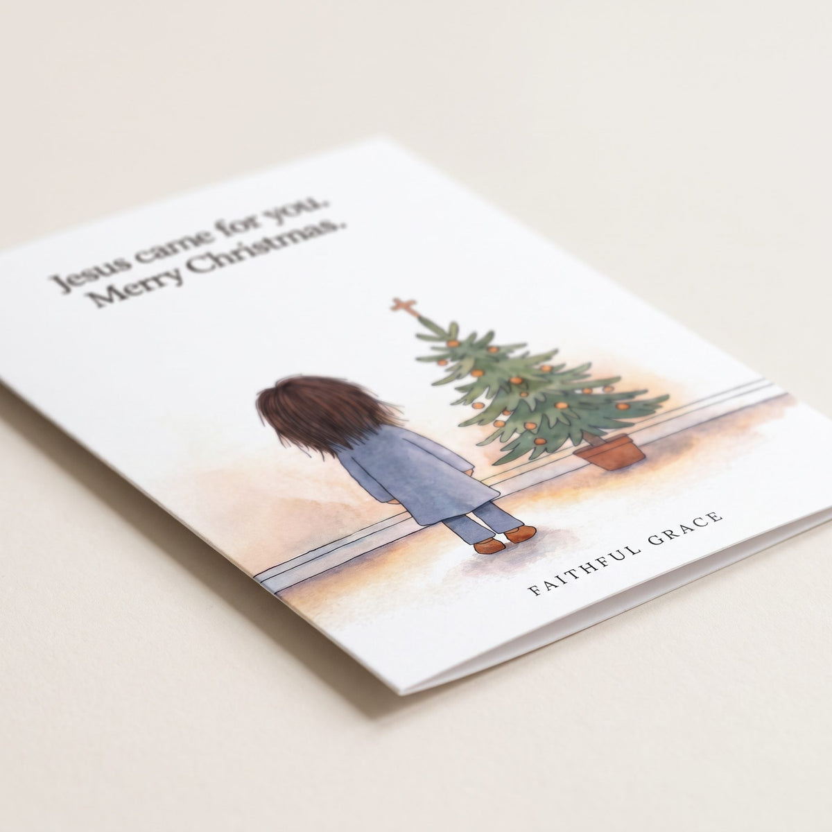 Close-up of the Jesus came for you card showing the smooth matte finish and fold