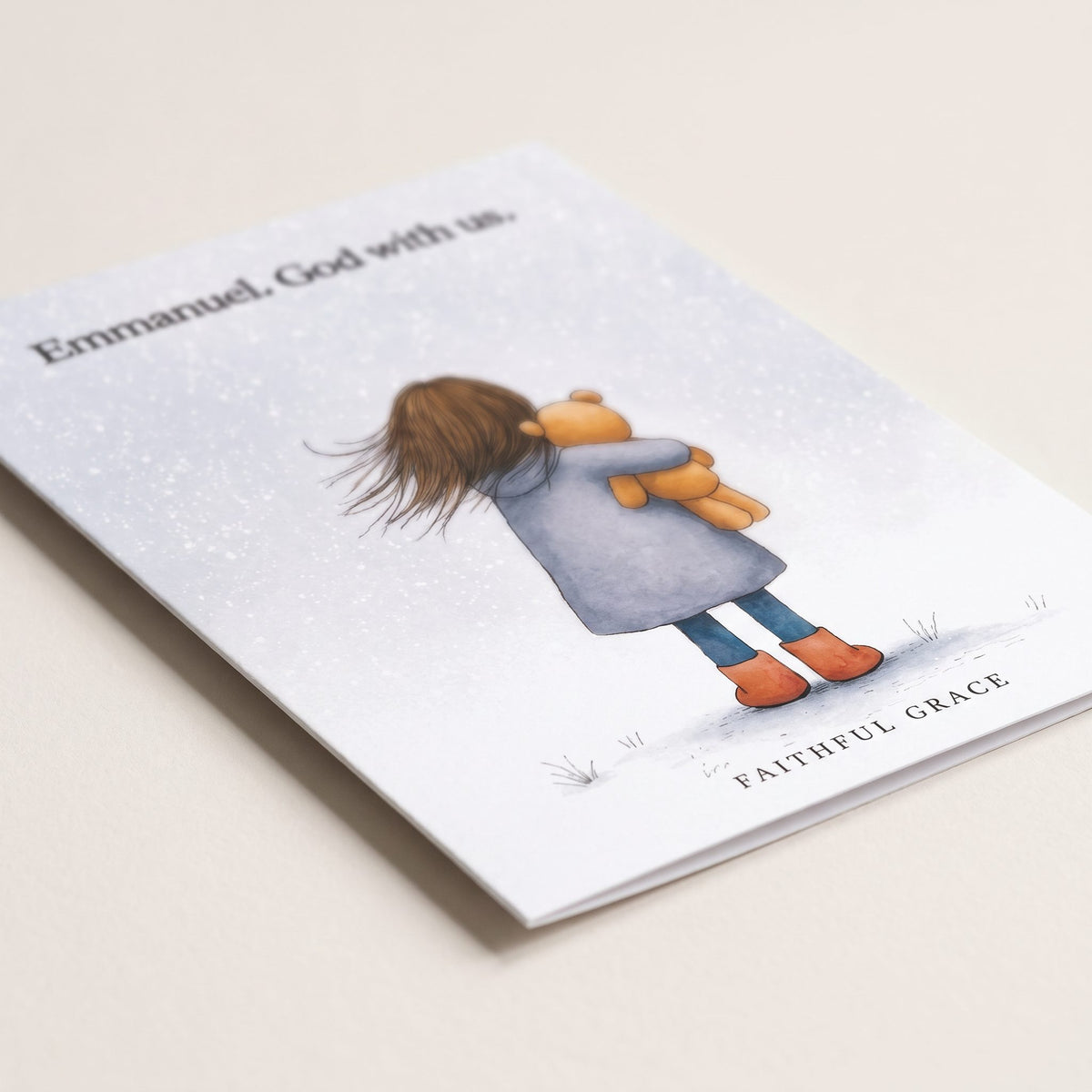 Close-up of the Emmanuel. God with us card showing the smooth matte finish and fold