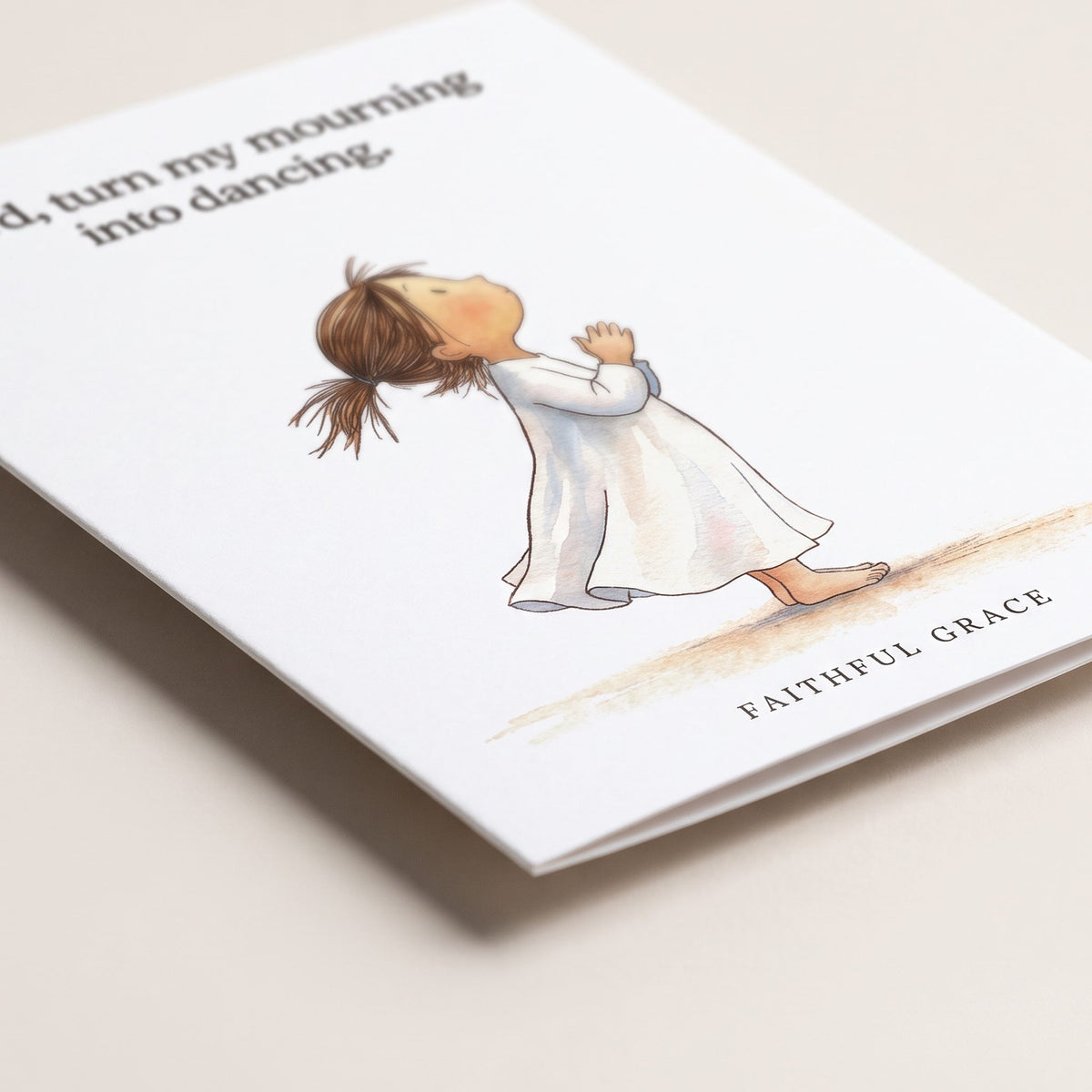 Close-up of the Turn my mourning into dancing card showing the smooth matte finish and fold