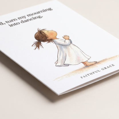 Close-up of the Turn my mourning into dancing card showing the smooth matte finish and fold