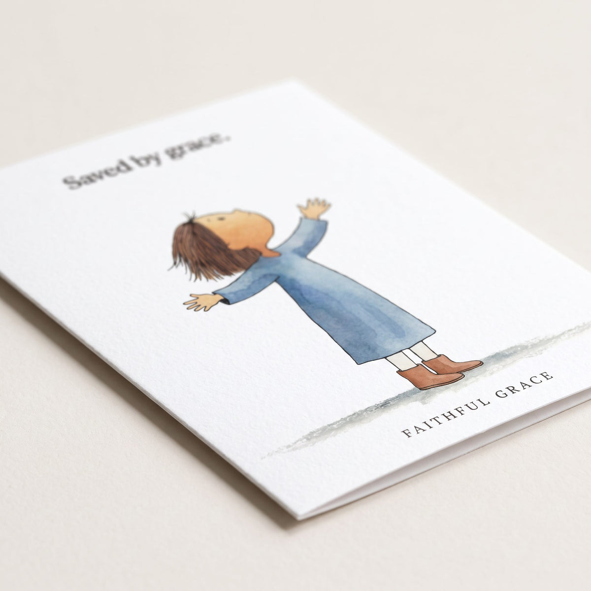 Close-up of the Saved by grace card showing the smooth matte finish and fold